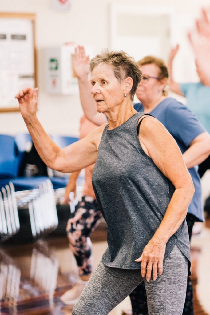 Avaleht Group of senior women dancing energetically in a fitness class promoting a healthy lifestyle.