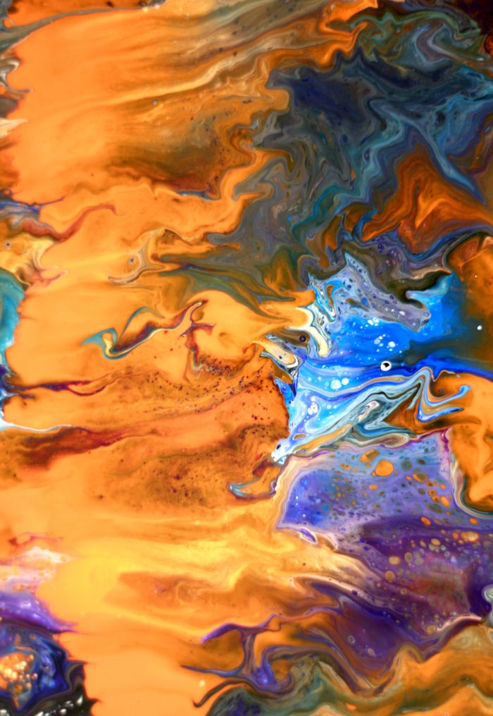 Dynamic fluid art piece showcasing vibrant orange and blue swirls with intricate details.