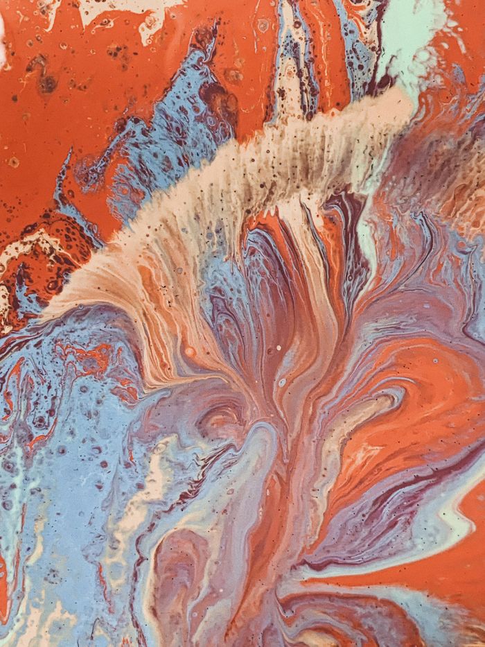pexels photo 3953123 Vibrant abstract marbling pattern with swirls of blue, red, and cream hues.